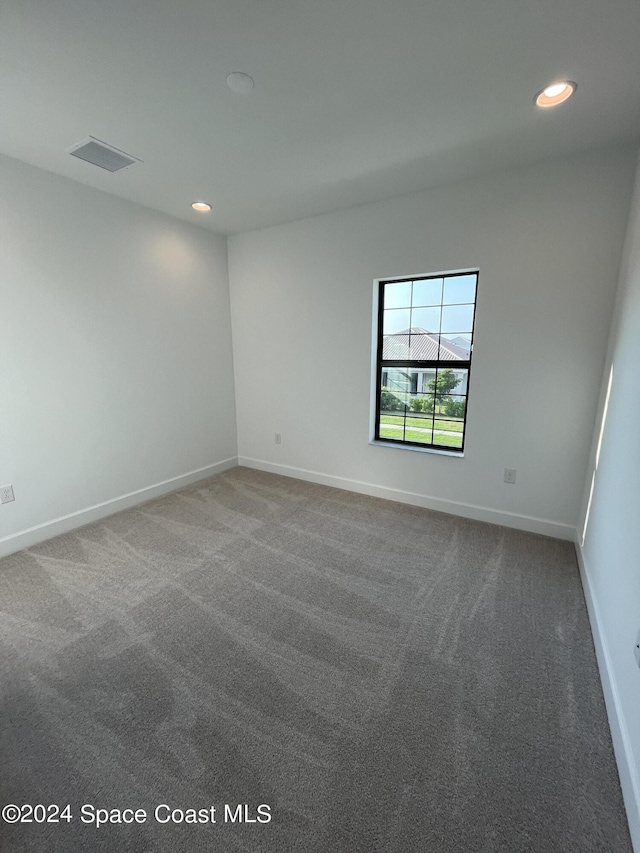 8526 Lyside Dr, Melbourne, FL 32940 - empty room featuring carpet floors, visible vents, recessed lighting, and baseboards