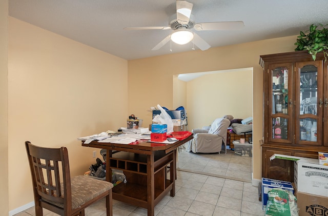 dining room with light tile flooring and ceiling fan