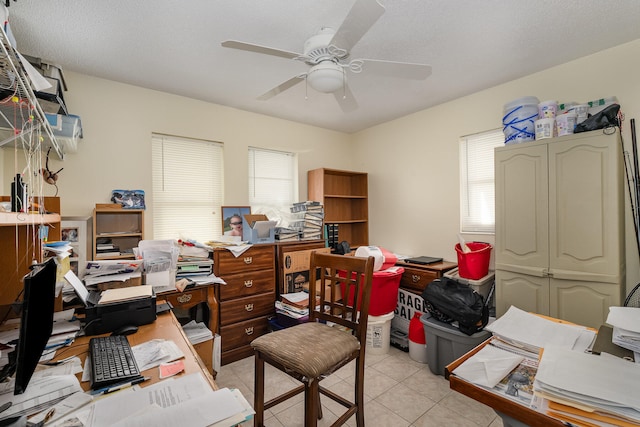 office space featuring light tile flooring and ceiling fan