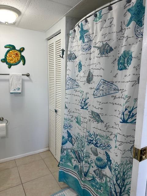 bathroom featuring tile floors