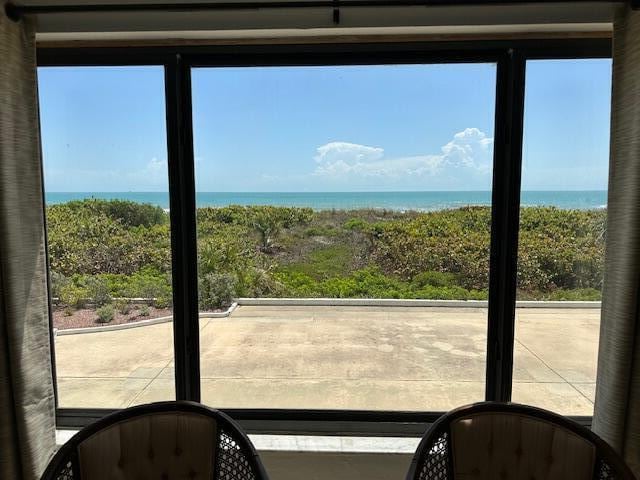 doorway to outside featuring a water view