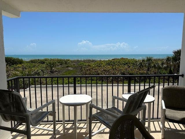 balcony featuring a water view