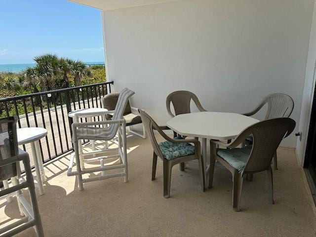 balcony featuring a water view