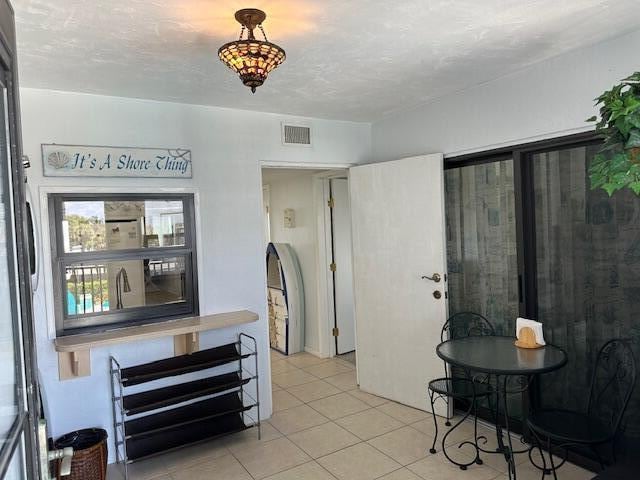 interior space featuring light tile floors