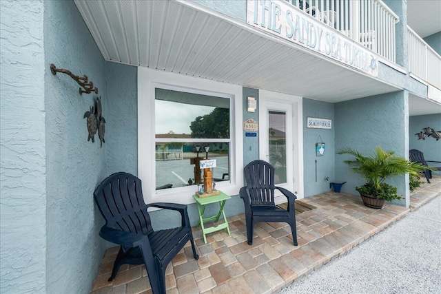 property entrance with a balcony