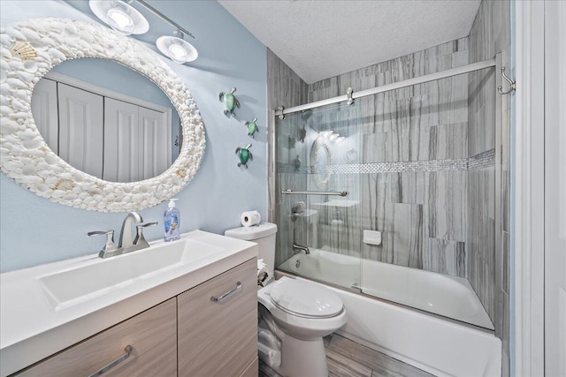 full bathroom with vanity, toilet, shower / bath combination with glass door, and a textured ceiling