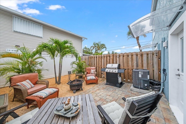 view of patio / terrace featuring area for grilling and a fire pit