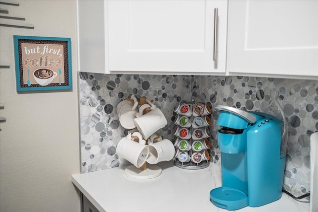 room details with backsplash and white cabinets