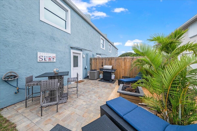 view of patio / terrace with grilling area and central air condition unit