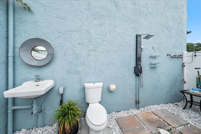 bathroom with toilet and sink