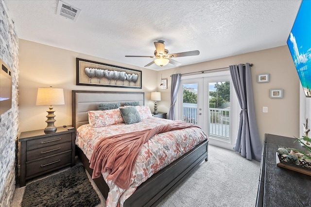 bedroom with access to exterior, french doors, light carpet, a textured ceiling, and ceiling fan