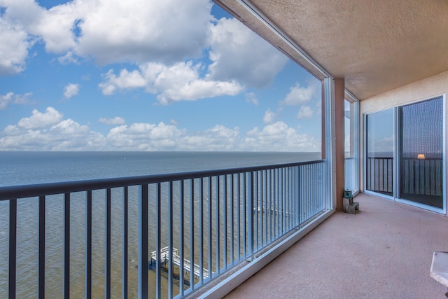 balcony featuring a water view