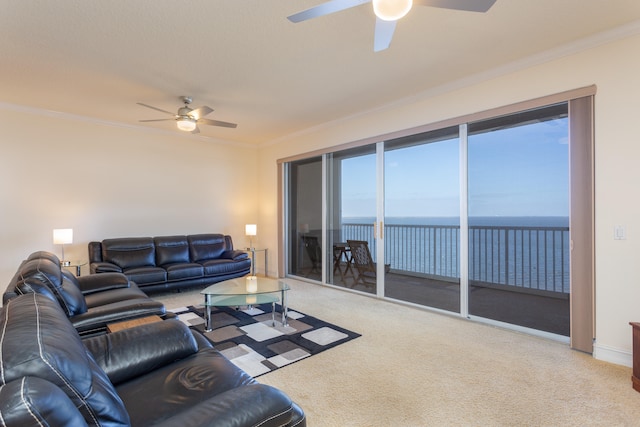 living room with light carpet, a water view, ceiling fan, and crown molding