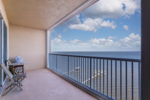 balcony featuring a water view