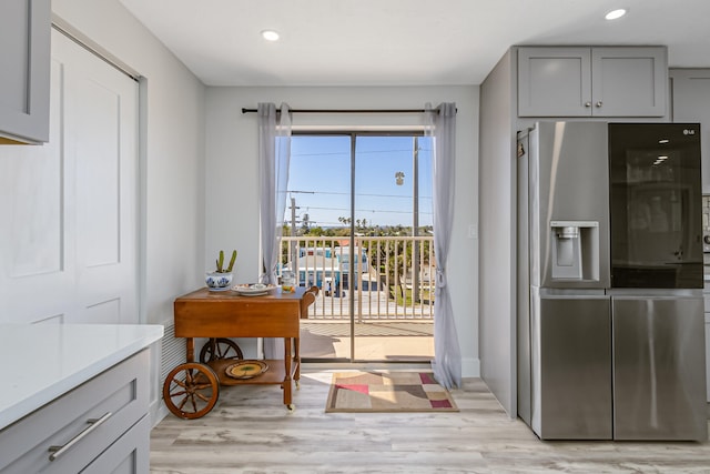 entryway with light hardwood / wood-style flooring