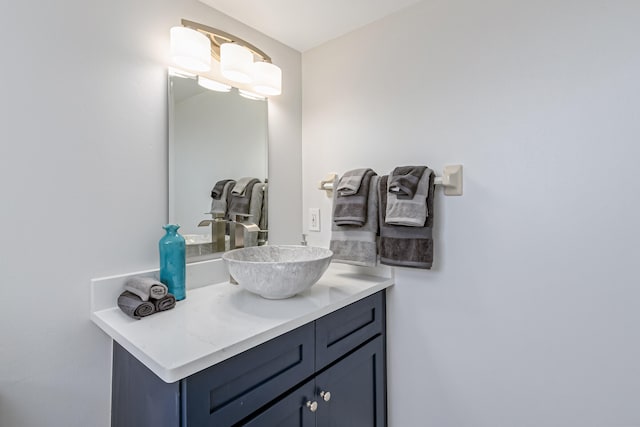 bathroom featuring vanity with extensive cabinet space