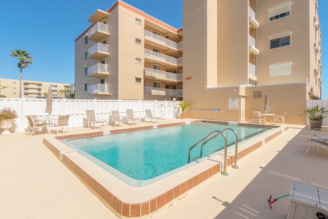 view of swimming pool with a patio