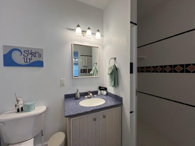 bathroom with vanity and toilet