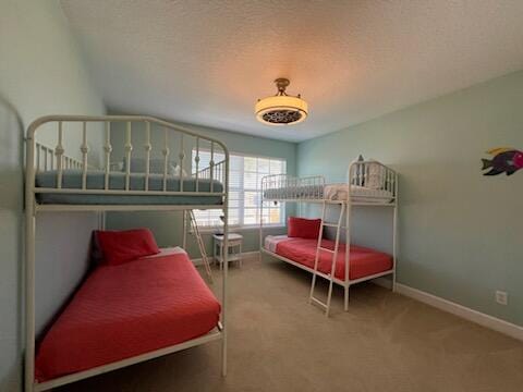 carpeted bedroom with a textured ceiling