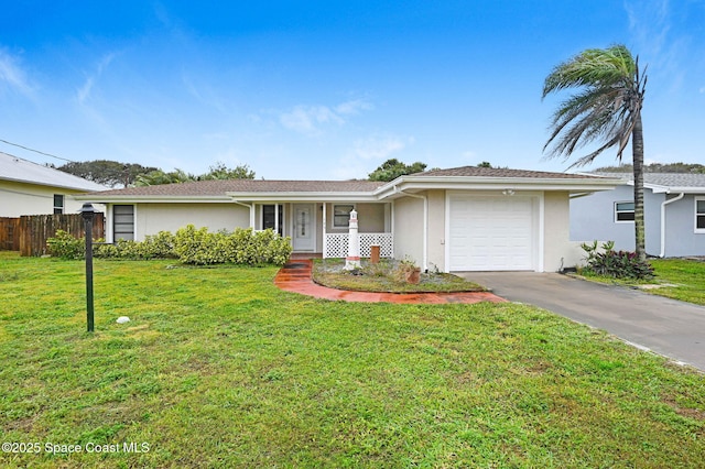 single story home featuring a front yard, a porch, and a garage