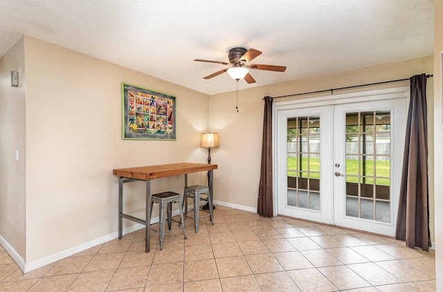 doorway to outside with light tile floors, ceiling fan, and french doors