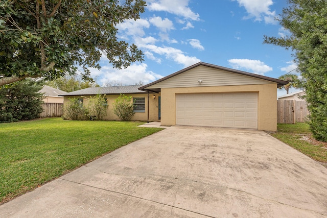 single story home featuring a front yard and a garage