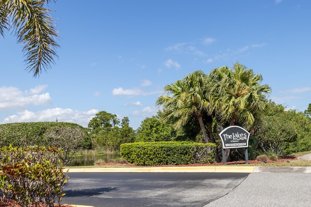 community sign with a water view