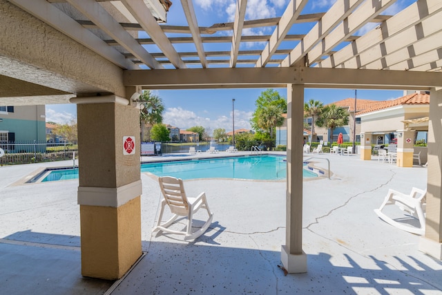 view of swimming pool with a pergola and a patio