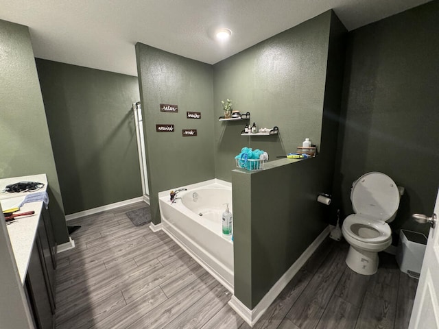 full bathroom with independent shower and bath, toilet, vanity, and hardwood / wood-style flooring