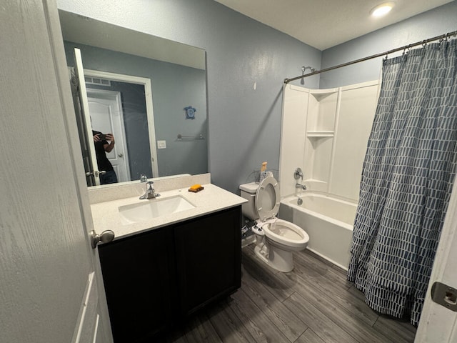 full bathroom with vanity, hardwood / wood-style floors, toilet, and shower / bath combination with curtain