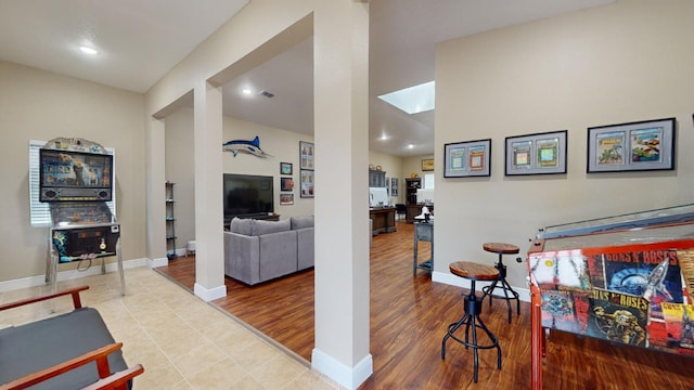 rec room featuring light tile flooring