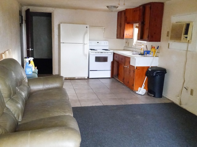 kitchen featuring light tile flooring, white appliances, and sink