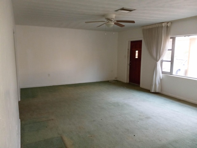 spare room with carpet flooring and ceiling fan