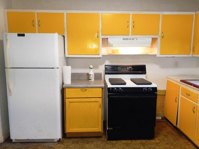 kitchen featuring tile flooring and white appliances