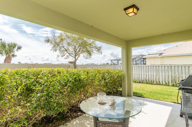 view of patio with a grill