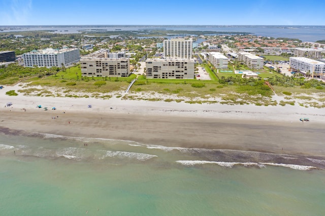 bird's eye view featuring a beach view and a water view