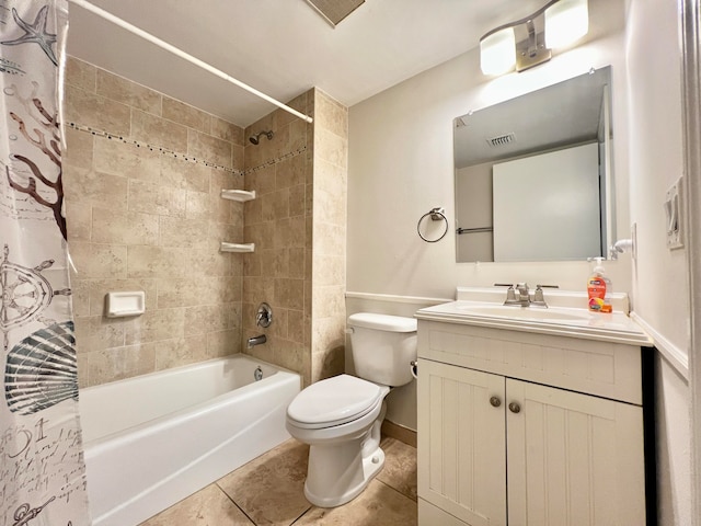 bathroom with visible vents, toilet, tile patterned floors, shower / bath combo with shower curtain, and vanity