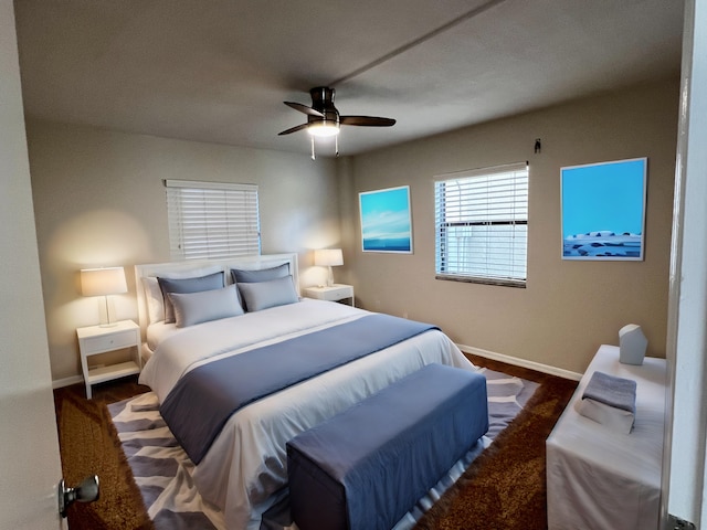 bedroom featuring ceiling fan and baseboards