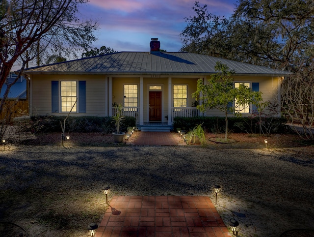 ranch-style home with a porch