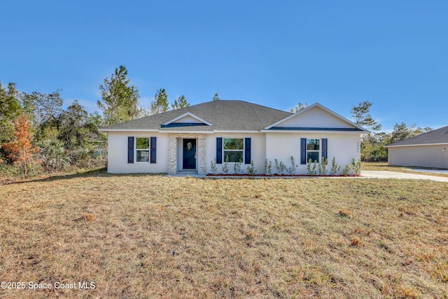 single story home featuring a front yard