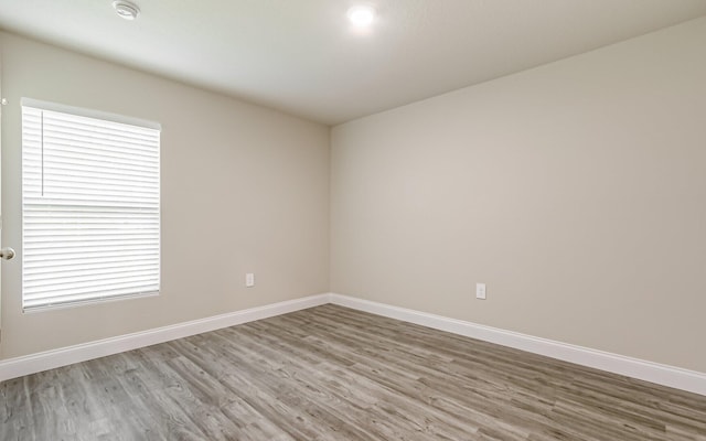 unfurnished room featuring light hardwood / wood-style flooring