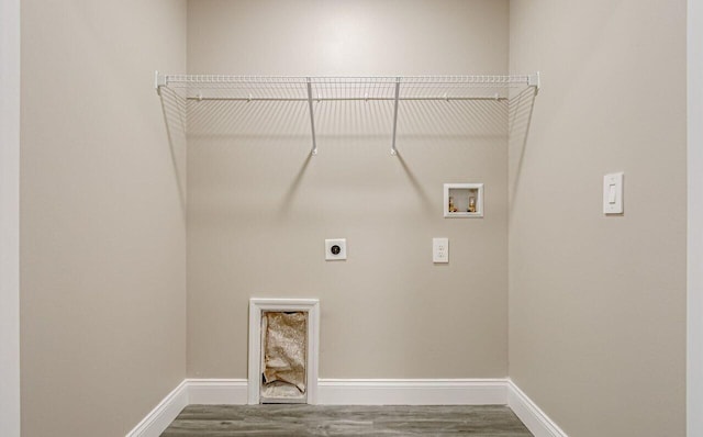 washroom featuring electric dryer hookup, hookup for a washing machine, and hardwood / wood-style flooring