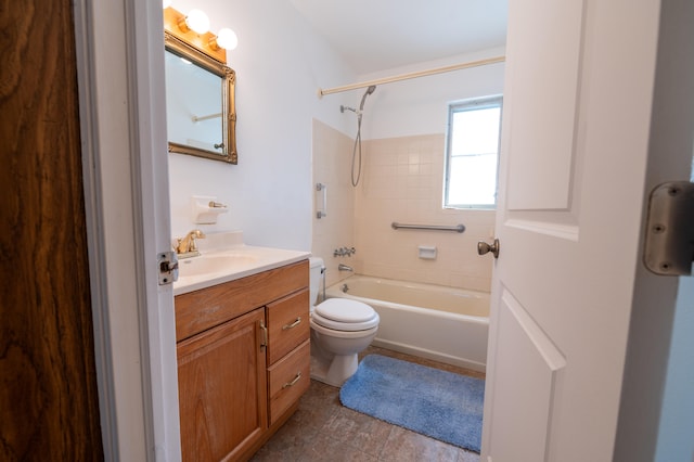 full bathroom featuring toilet, tile patterned floors, vanity, and tiled shower / bath combo