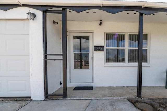 property entrance featuring a garage