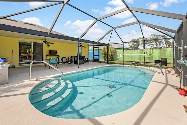 view of pool with a lanai, a patio area, and ceiling fan