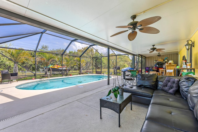 view of swimming pool with glass enclosure, outdoor lounge area, ceiling fan, and a patio