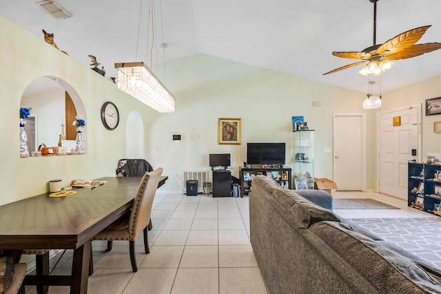 dining room with light tile floors, high vaulted ceiling, and ceiling fan