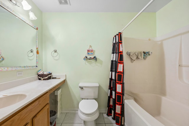 full bathroom featuring toilet, vanity with extensive cabinet space, tile flooring, and shower / tub combo