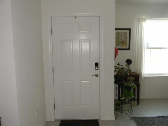 entrance foyer with light tile floors