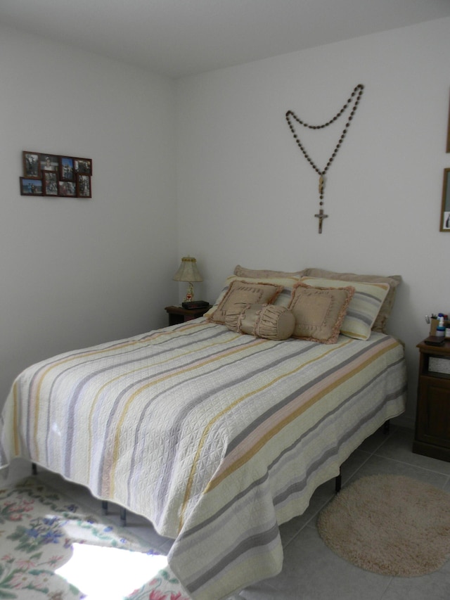 bedroom featuring tile floors